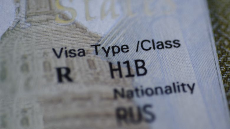 A close-up view of the H1B visa stamp in a passport.
