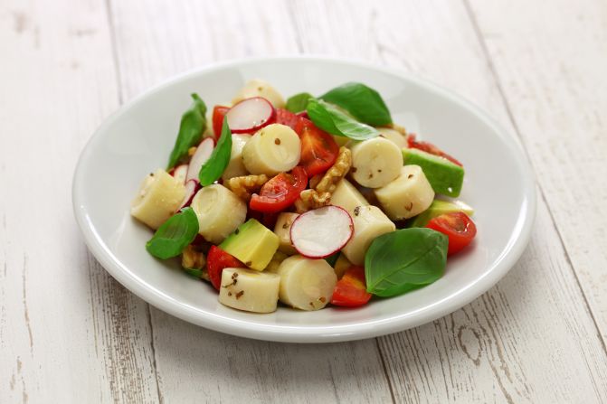 <strong>Ensalada de Palmitos (Argentina): </strong>Hearts of Palm salad, dressed in a lime juice mixture, and topped with scallion and cilantro, is associated with Argentina but is also enjoyed throughout Latin America