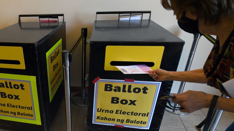 A voter puts a mail-in ballot in a ballot box at the Clark County Election Department, which serves as a drive-up and walk-up election ballot drop-off point on October 13, 2020, in North Las Vegas, Nevada.