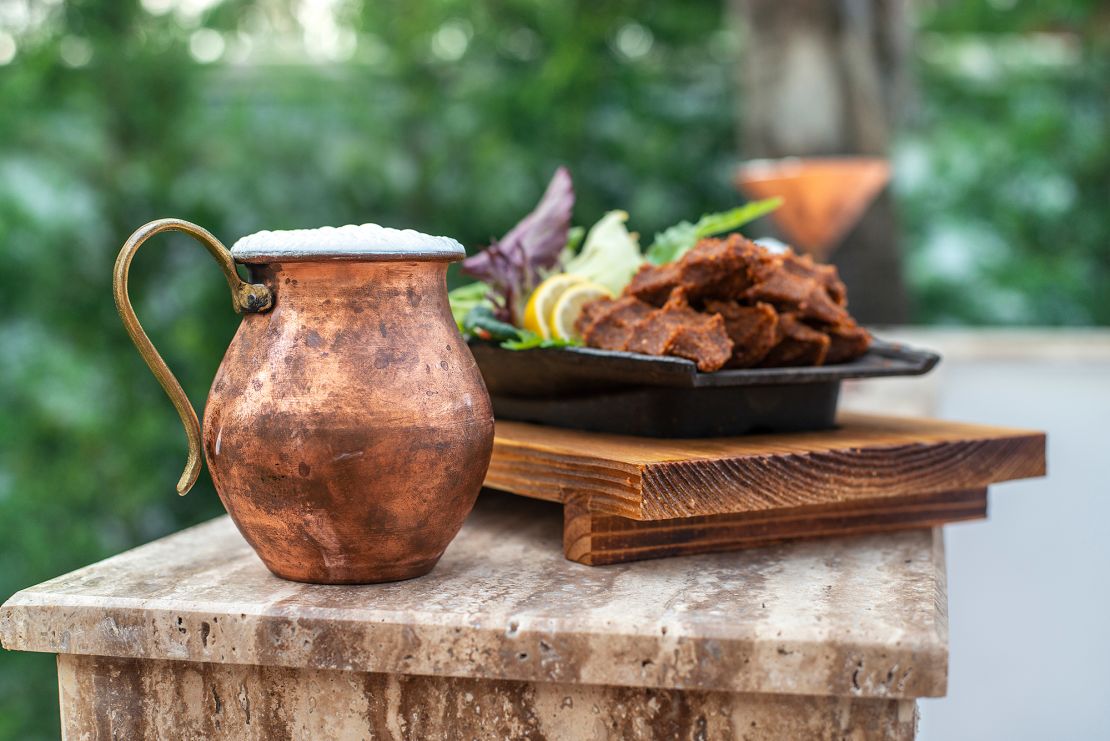 Traditionally, Ayran is often served in copper cups.