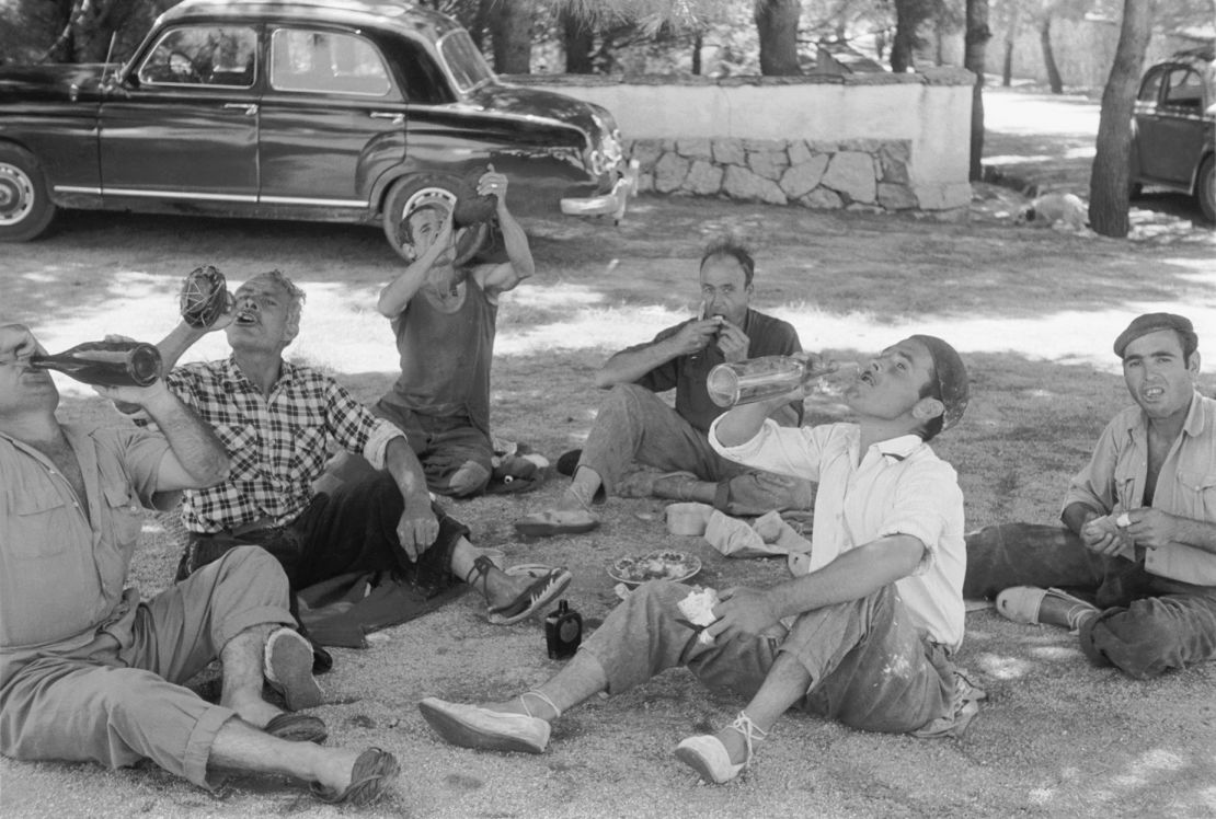Siestas began as a traditional break for workers to avoid the intense heat of the midday sun, like these men pictured in the 1950s.