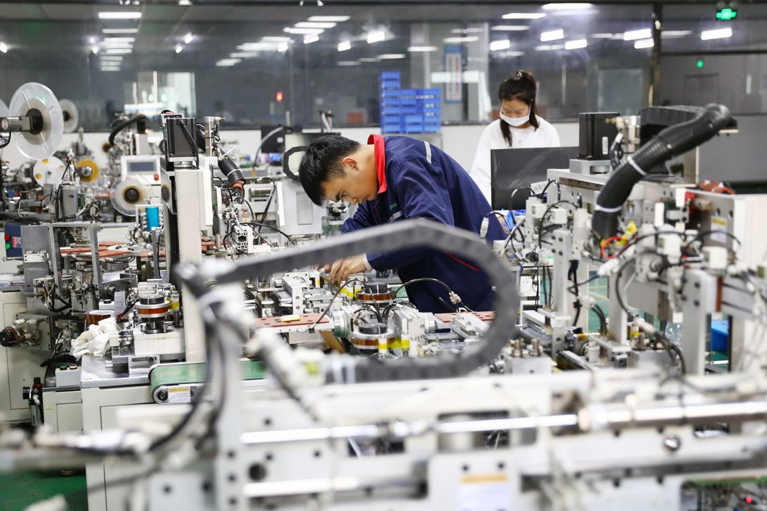 An employee works on the production line of lithium-ion battery at a factory on November 14, 2020 in Huaibei, Anhui province, China.