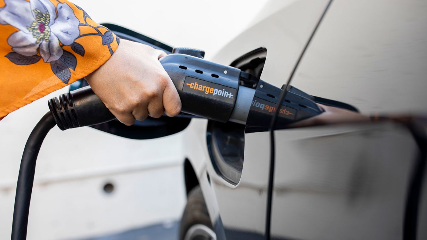 An electric car charges at a station in Oakland, California in 2020.