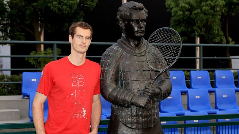 SHANGHAI, CHINA - OCTOBER 11:  Andy Murray of Great Britain poses for photographers at the unvieling of a statue of his likeness as a terra cotta warrior during the Shanghai Rolex Masters at the Qi Zhong Tennis Center on October 11, 2011 in Shanghai, China.  (Photo by Matthew Stockman/Getty Images)