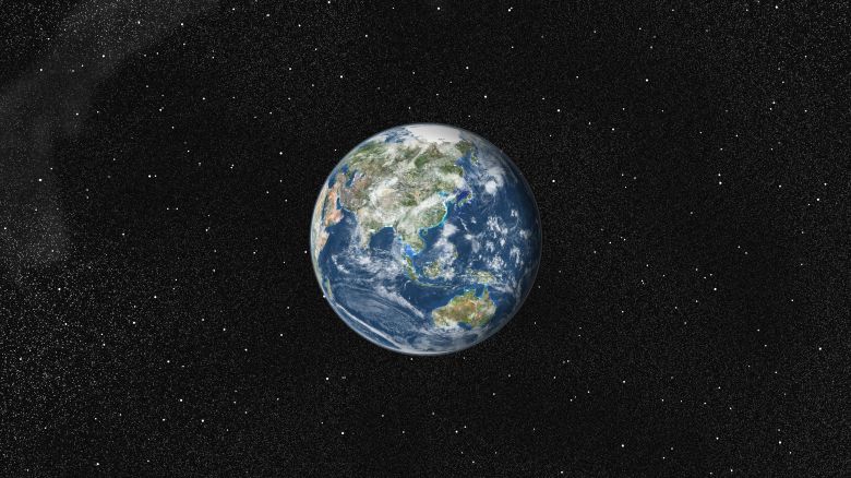 True color satellite image of the Earth centred on Asia and Oceania with cloud coverage. This image in orthographic projection was compiled from data acquired by LANDSAT 5 & 7 satellites., Globe Centred On Asia And Oceania, True Colour Satellite Image. Taken on January 1, 2002.