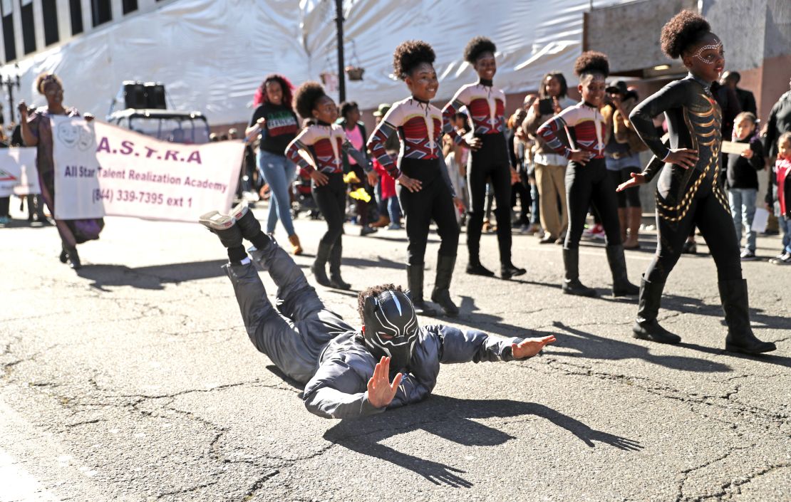 A student from All Star Talent Realization Academy abreak dances while wearing a Black Panther mask during Black Joy Parade in Oakland, Calif., on Sunday, February 25, 2018. (Photo by Scott Strazzante/San Francisco Chronicle via Getty Images)