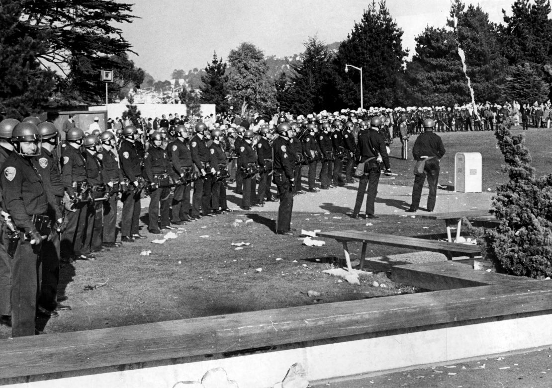 Policemen in riot gear enter the San Francisco State campus in a show of force during student demonstrations that were meant to shut the college down during a strike December 4, 1968.