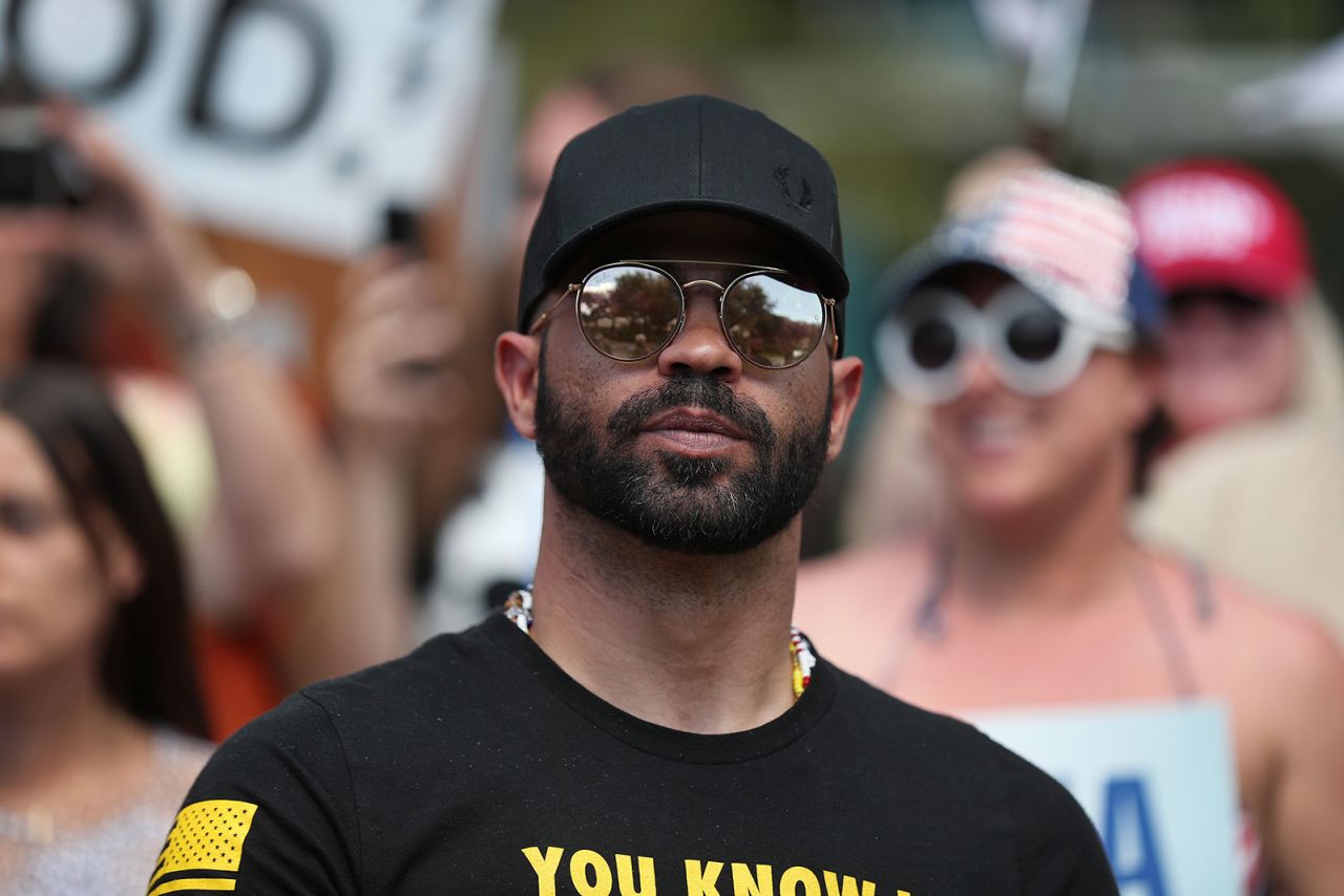 Enrique Tarrio, leader of the Proud Boys, stands outside of the Hyatt Regency where the Conservative Political Action Conference was being held on February 27, 2021 in Orlando, Florida.