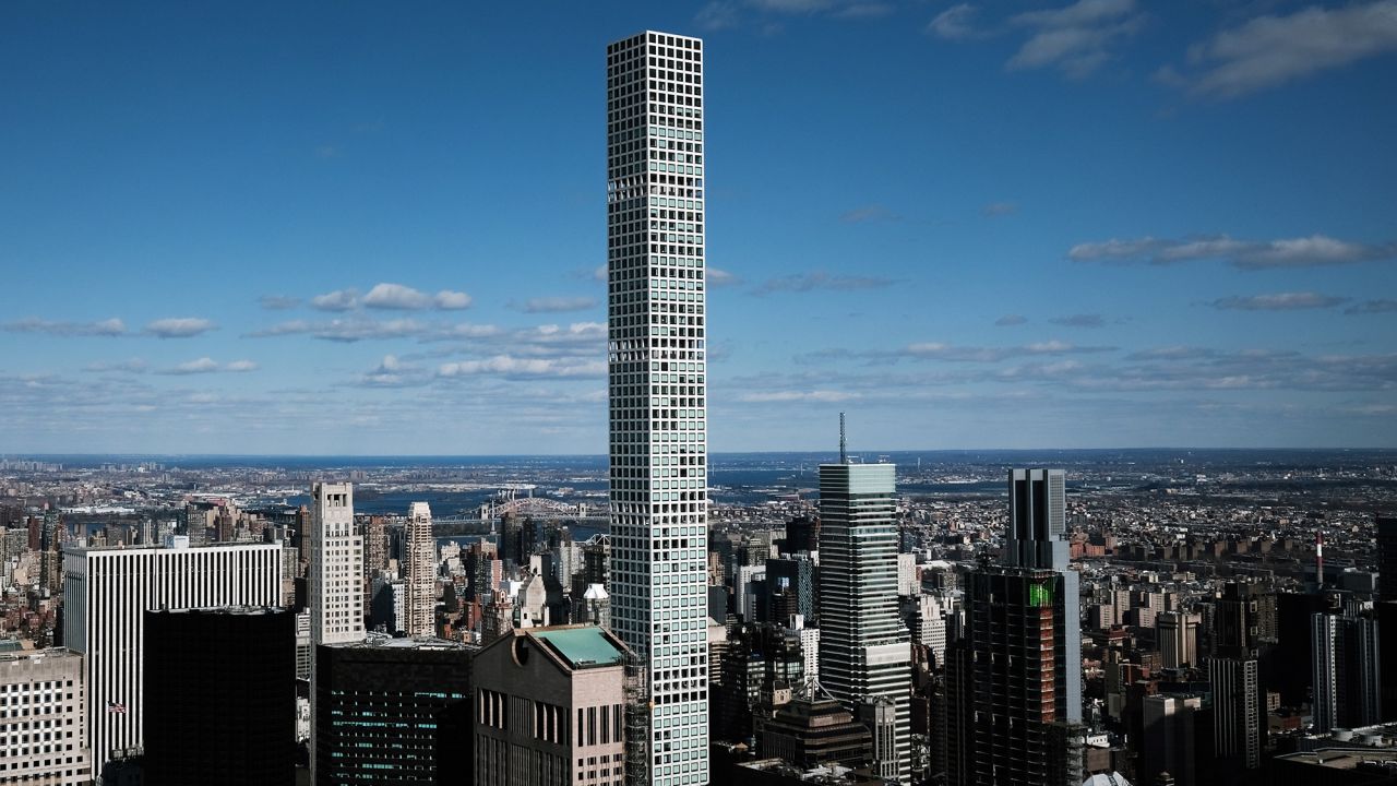 NEW YORK, NEW YORK - MARCH 04:  The private residence 432 Park Avenue towers above office buildings which stand largely empty on March 04, 2021 in New York City. According to Colliers International, in January the office available rate in Manhattan rose to 14.9%, which is the highest level on record dating back to 2000. Some companies are slowly asking employees to return to the office while other's are waiting for more New Yorkers to receive the vaccine for Covid-19. (Photo by Spencer Platt/Getty Images)