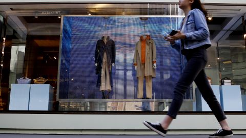 A woman walks in front a Burberry store on March 12, 2021 in New York City.