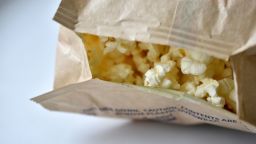 Microwave popcorn on a white background in a bag