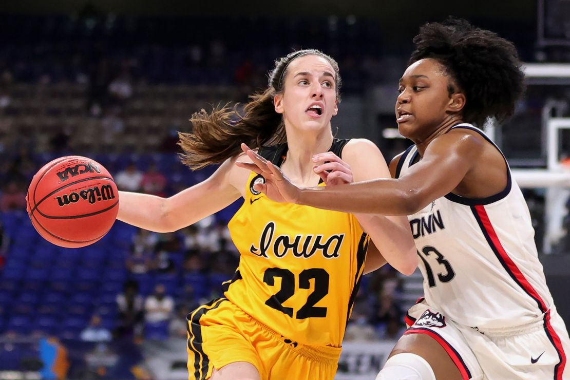 Clark against Christyn Williams of the UConn Huskies during the Sweet Sixteen round of the 2021 Women's March Madness.
