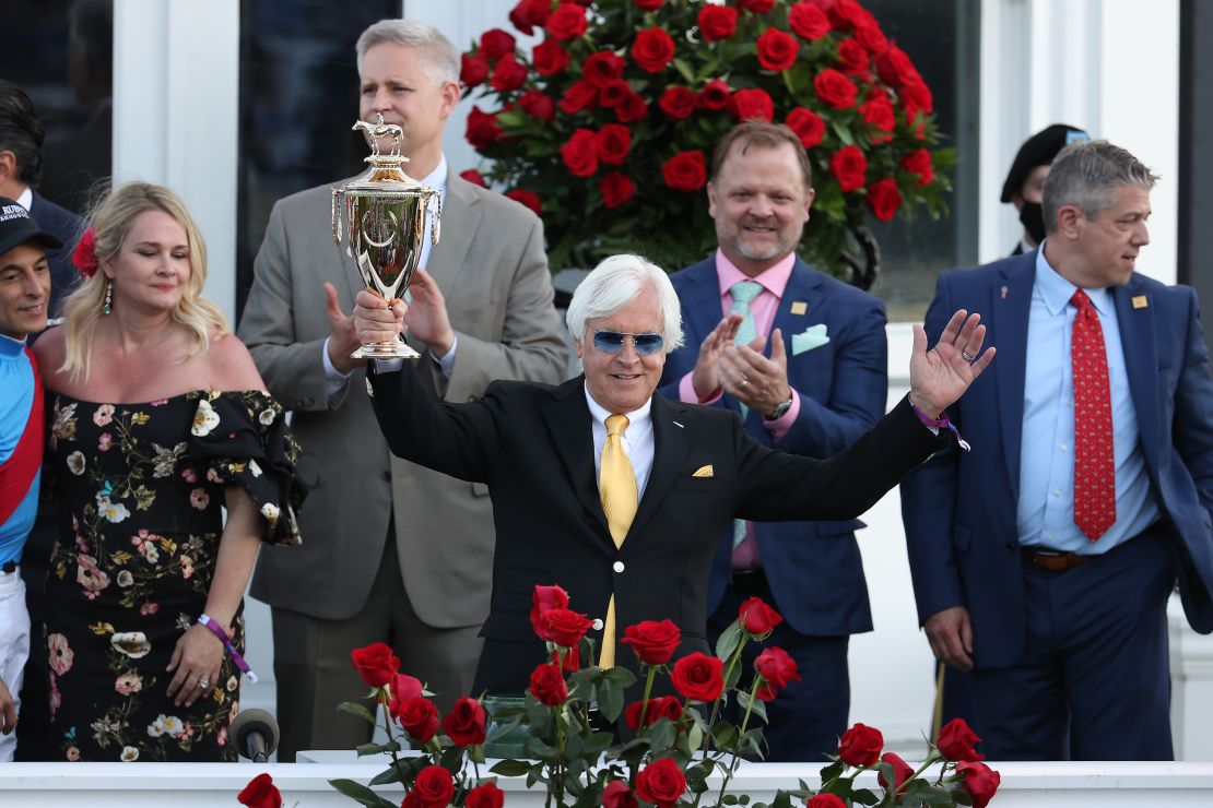 Trainer Bob Baffert of Medina Spirit, raises the trophy after winning the 147th running of the Kentucky Derby with Medina Spirit, his seventh career Kentucky Derby win.