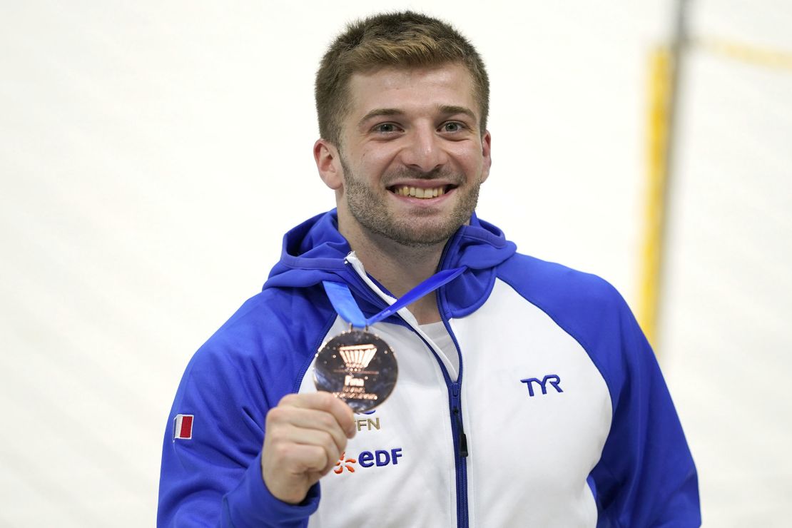 Alexis Jandard poses with his bronze medal after the men's three-meter springboard final at the Diving World Cup in Tokyo in 2021.