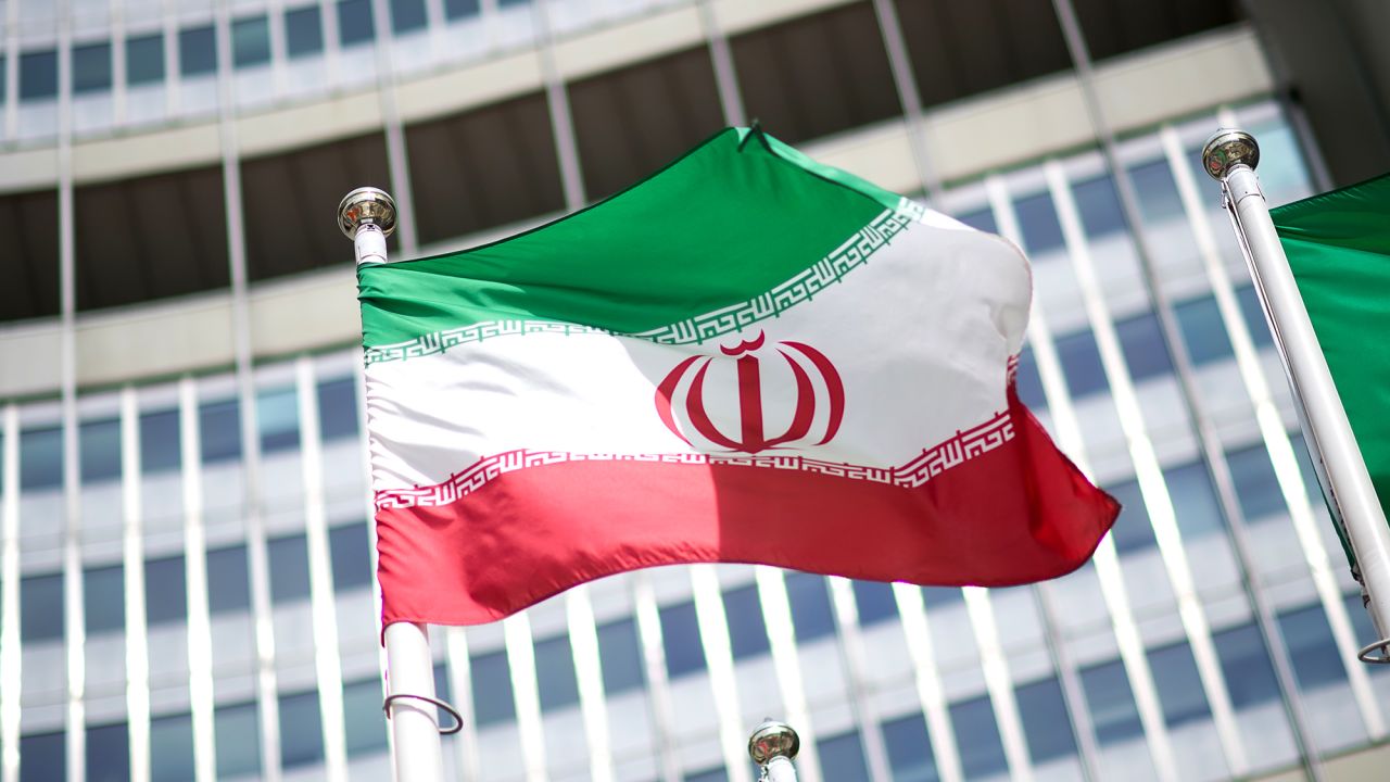 The flag of Iran is seen in front of the building of the International Atomic Energy Agency (IAEA) Headquarters ahead of a press conference by Rafael Grossi, Director General of the IAEA, about the agency's monitoring of Iran's nuclear energy program on May 24, 2021 in Vienna, Austria.