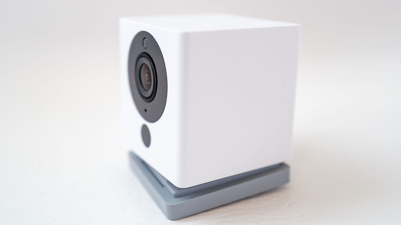 Side shot of a Wyze Cam v2 security camera isolated on a white background.