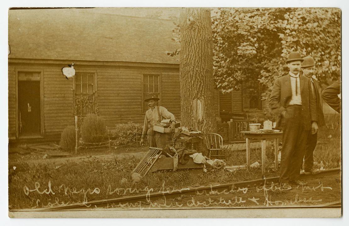 An elderly man gathering possessions after the 1908 race riot in Springfield, Illinois.