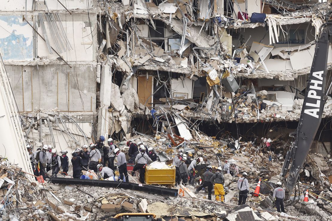 Search and rescue teams search for possible survivors and remains at the partially collapsed Champlain Towers South condo building on June 30, 2021 in Surfside, Florida.