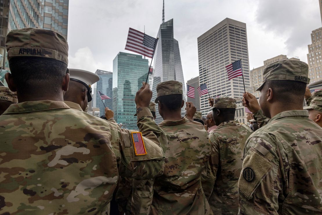 US Army soldiers pose for a photo after becoming American citizens at a naturalization ceremony in July 2021 in New York City.