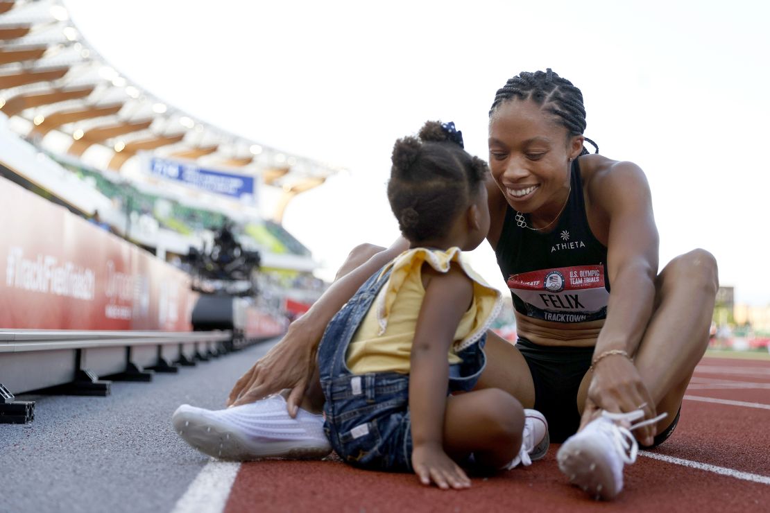 EUGENE, OREGON - JUNE 20: Allison Felix celebrates with her daughter Camryn after finishing second in the women's 400 meters final at the 2020 US Olympic Track and Field Team Trials at Hayward Field on June 20, 2021 in Eugene, Oregon.  (Photo by Steph Chambers/Getty Images)