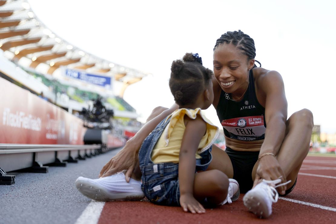EUGENE, OREGON - JUNE 20: Allison Felix celebrates with her daughter Camryn after finishing second in the women's 400 meters final at the 2020 US Olympic Track and Field Team Trials at Hayward Field on June 20, 2021 in Eugene, Oregon. (Photo by Steph Chambers/Getty Images)