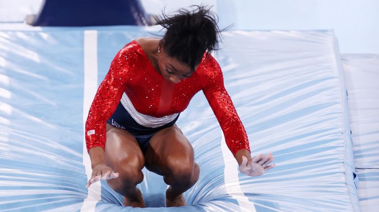 TOKYO, JAPAN - JULY 27: Simone Biles of Team United States stumbles upon landing after competing in vault during the Women's Team Final on day four of the Tokyo 2020 Olympic Games at Ariake Gymnastics Centre on July 27, 2021 in Tokyo, Japan. (Photo by Jamie Squire/Getty Images)