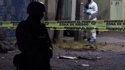 A member of the National Guard stands guard at the zone where a car bomb exploded in Celaya, Guanajuato state, Mexico on June 29, 2023. A car bomb seriously wounded at least four members of the security forces in a central Mexican region hit hard by cartel-linked violence, authorities said Thursday. The blast happened when members of the National Guard were inspecting a bullet-riddled abandoned vehicle on Wednesday night in Celaya in Guanajuato state, according to sources at the state prosecutor's office. (Photo by AFP) (Photo by STR/AFP via Getty Images)