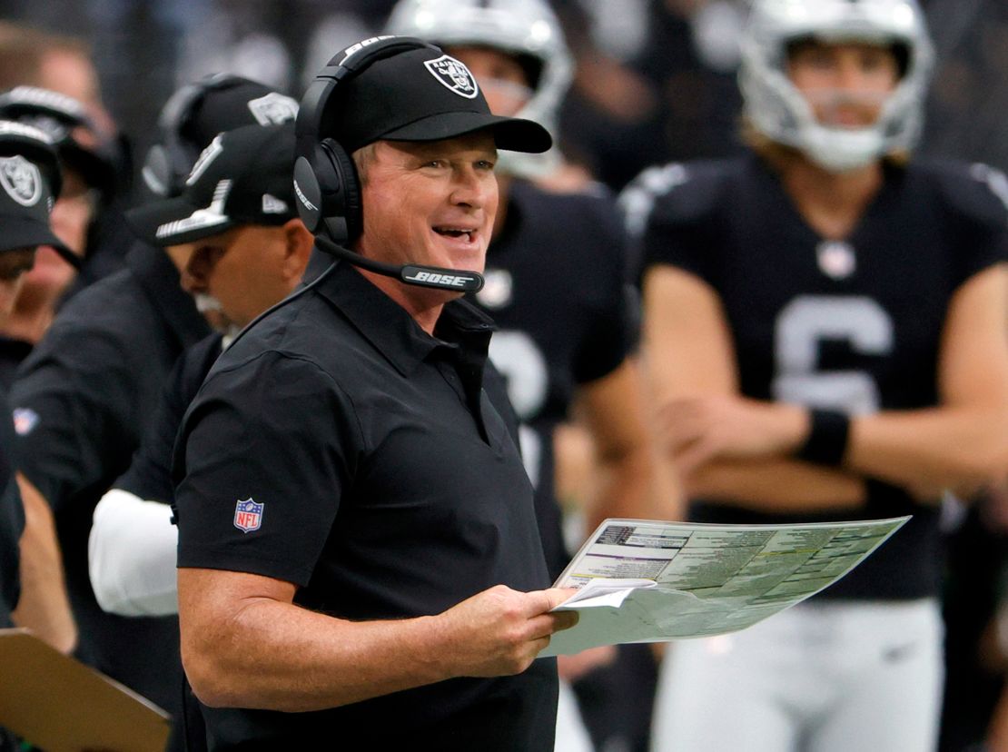 Las Vegas Raiders head coach Jon Gruden smiles on the sidelines during a game against the Miami Dolphins at Allegiant Stadium on September 26, 2021 in Las Vegas, Nevada.