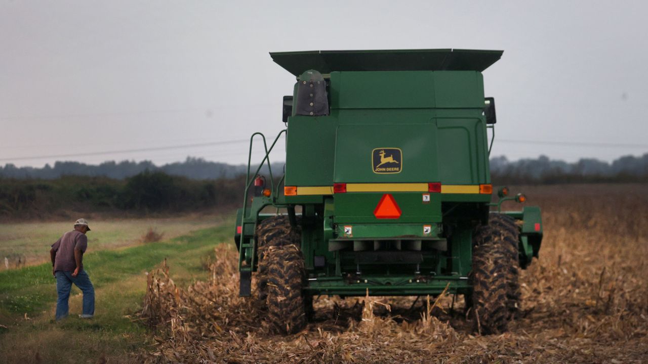 Glenn Morris, 83, harvests corn on October 11, 2021 in Princeton, Indiana.