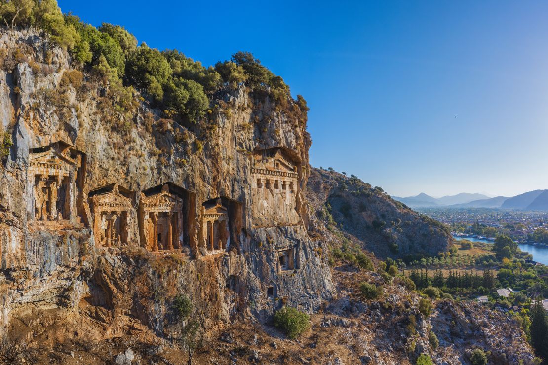 Rock tombs of former kings are built into the high cliffs over the ruins of Ancient Kaunos, opposite Dalyan.