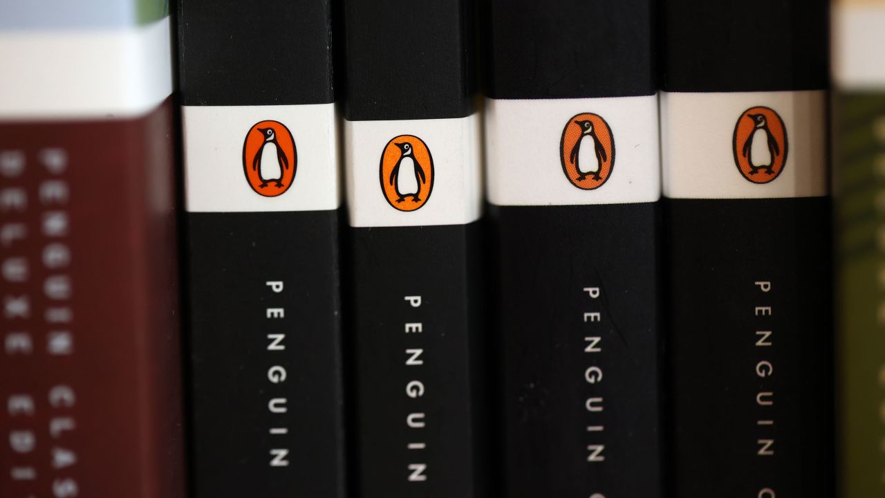 CORTE MADERA, CALIFORNIA - NOVEMBER 02: The Penguin logo is visible on the spines of books displayed on a shelf at Book Passage  on November 02, 2021 in Corte Madera, California. The U.S. Department of Justice is suing Penguin Random House and Simon & Schuster to block the companies from completing a merger valued at $2.175 billion. (Photo by Justin Sullivan/Getty Images)