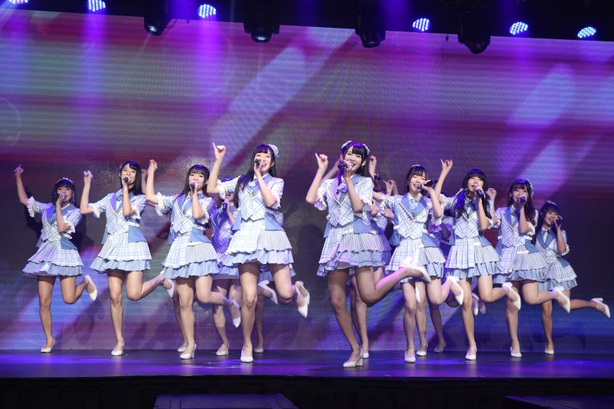 Members of AKB48, pictured on stage in 2021