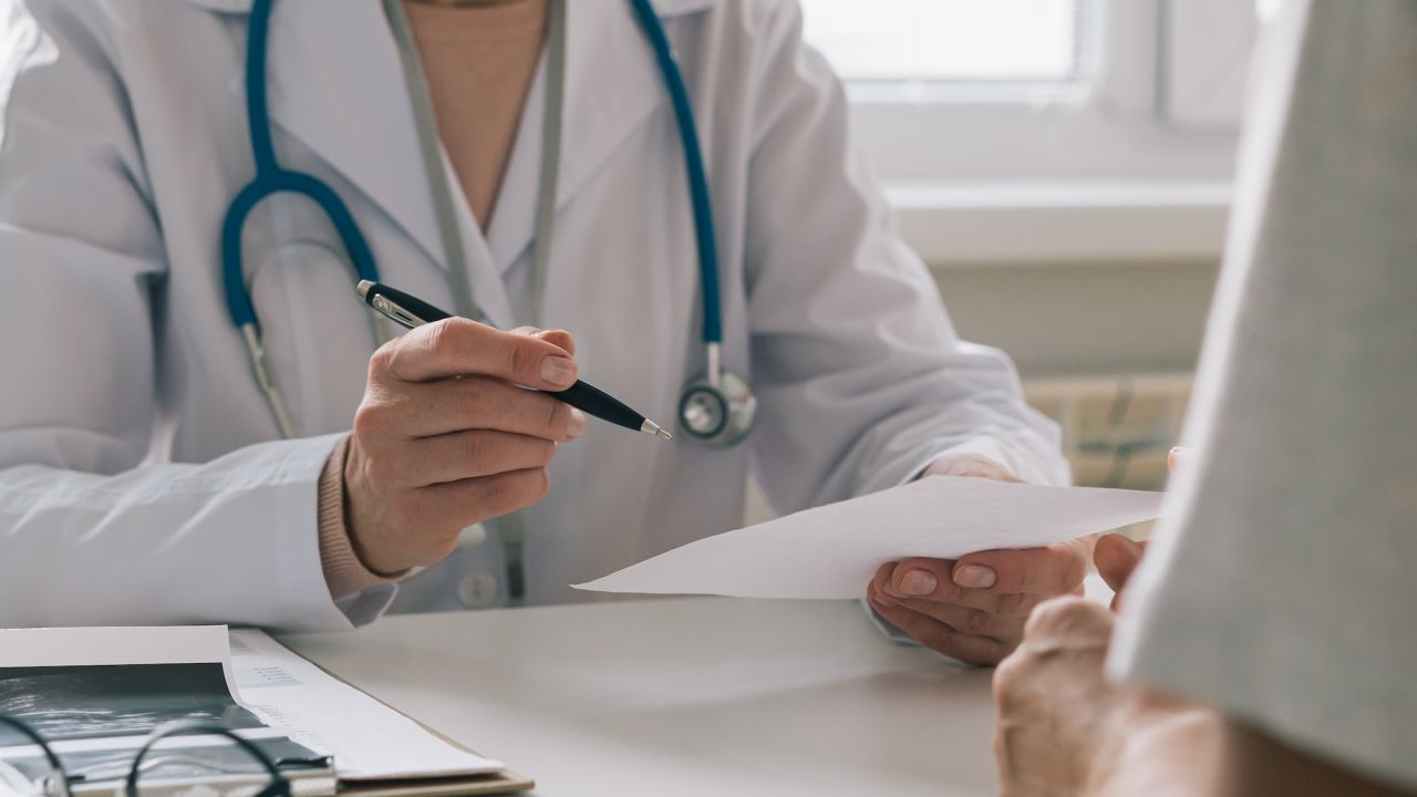 Unrecognizable female doctor consulting patient. Giving instructions and recommendations. Medical symptom diagnostic. Questioning about treatment. Clinical reception