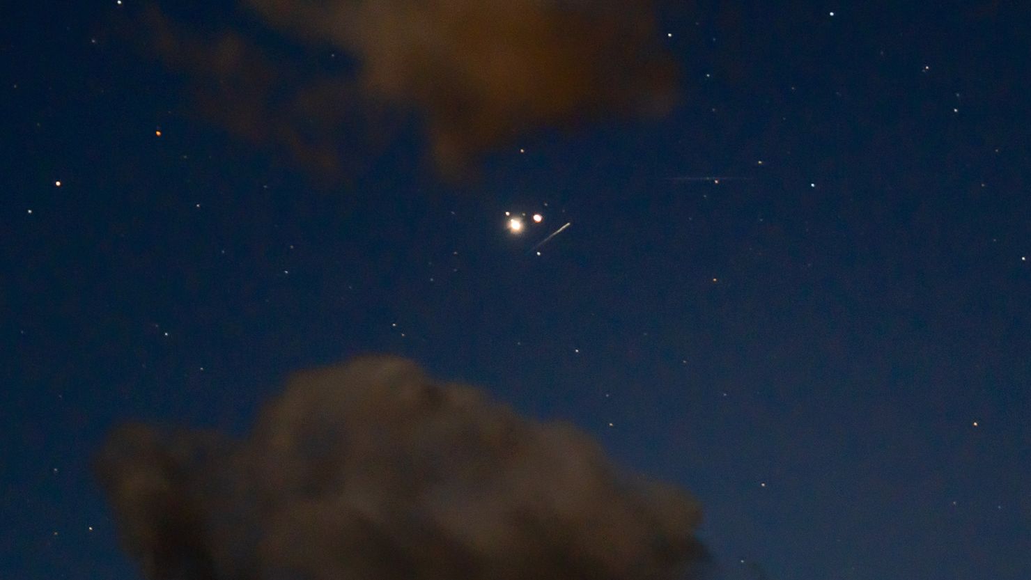 Ursid meteors are seen alongside Jupiter and Saturn's great conjunction in 2020 over Ashland, Oregon. This year, the Ursids will peak on the night of December 21 through the early morning of December 22.