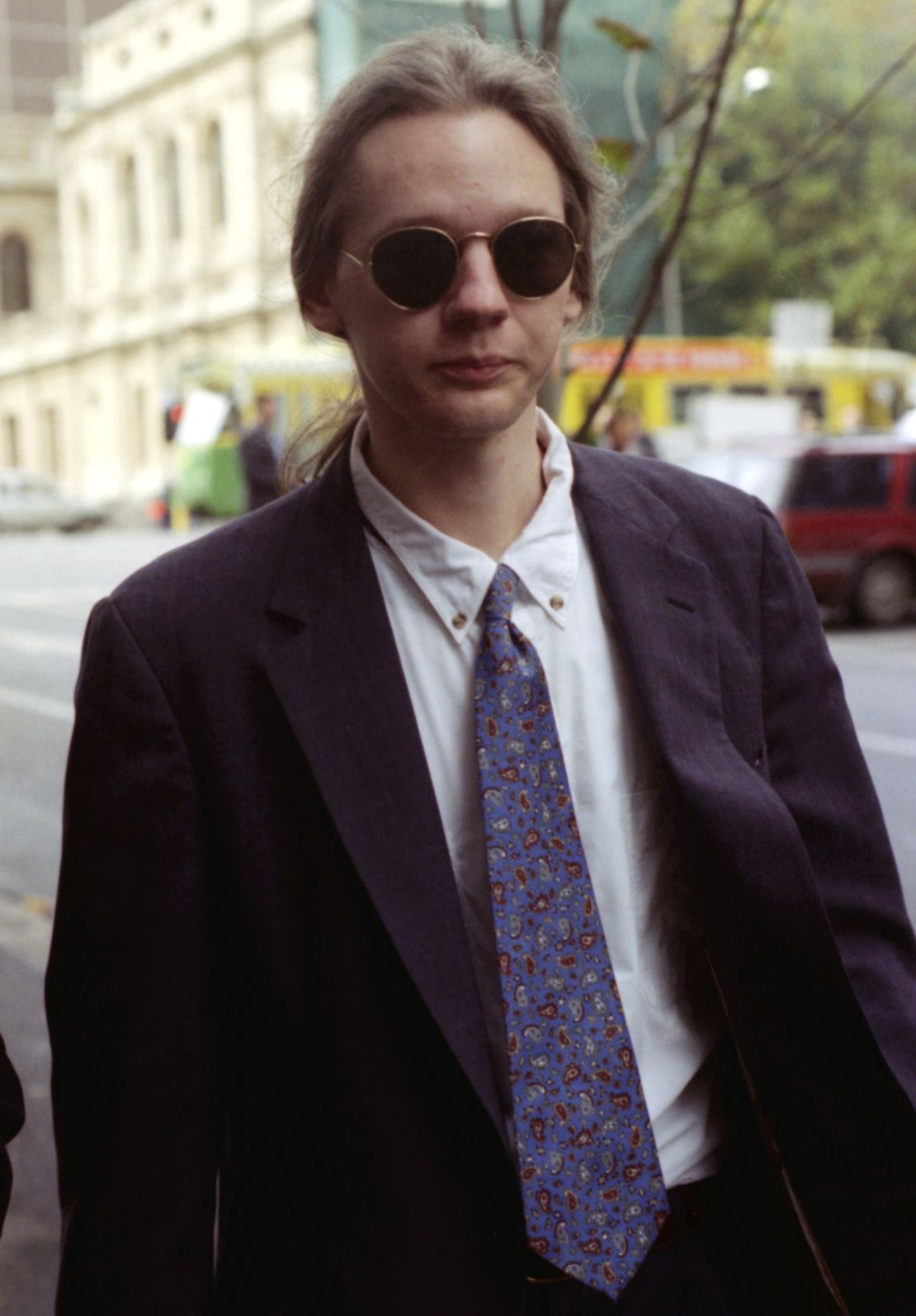 Julian Assange leaves a Melbourne court after facing charges of computer hacking in 1995. 