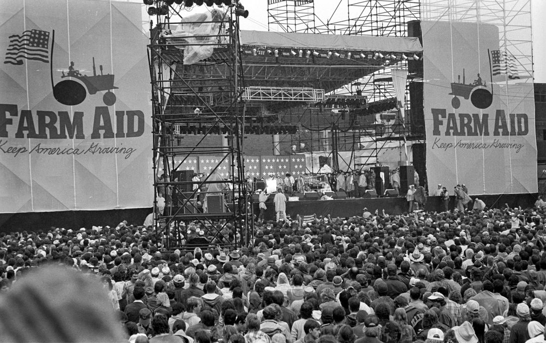 View of the crowd during the debut Farm Aid benefit festival in Champaign, Illinois, on September 22, 1985.