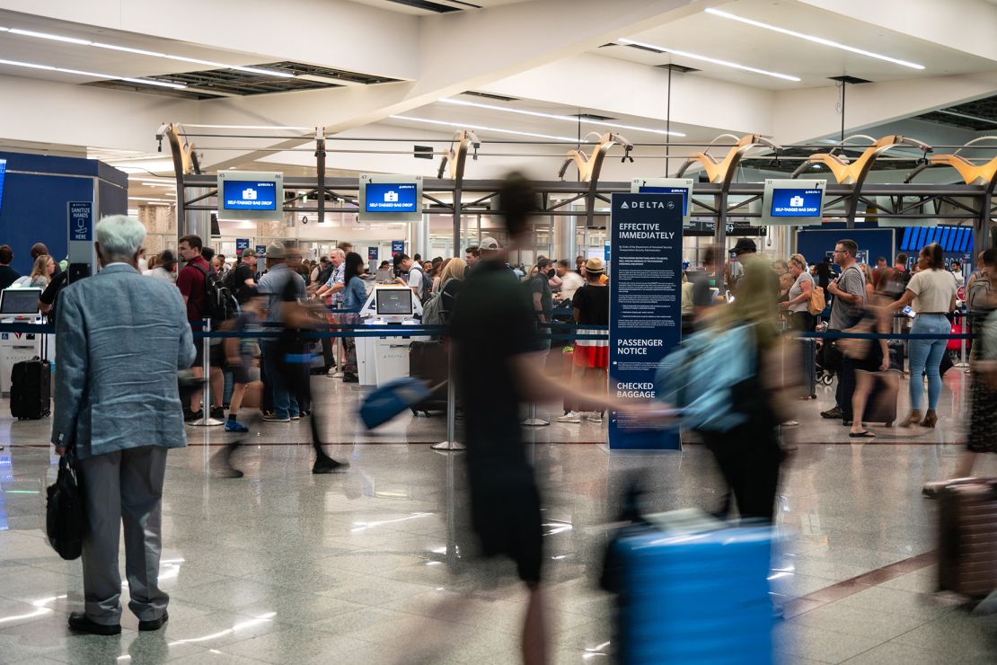 Travelers are seen ahead of the Fourth of July holiday weekend at Hartsfield-Jackson Atlanta International Airport last year. Expect a sea of companionship at US airports this summer.