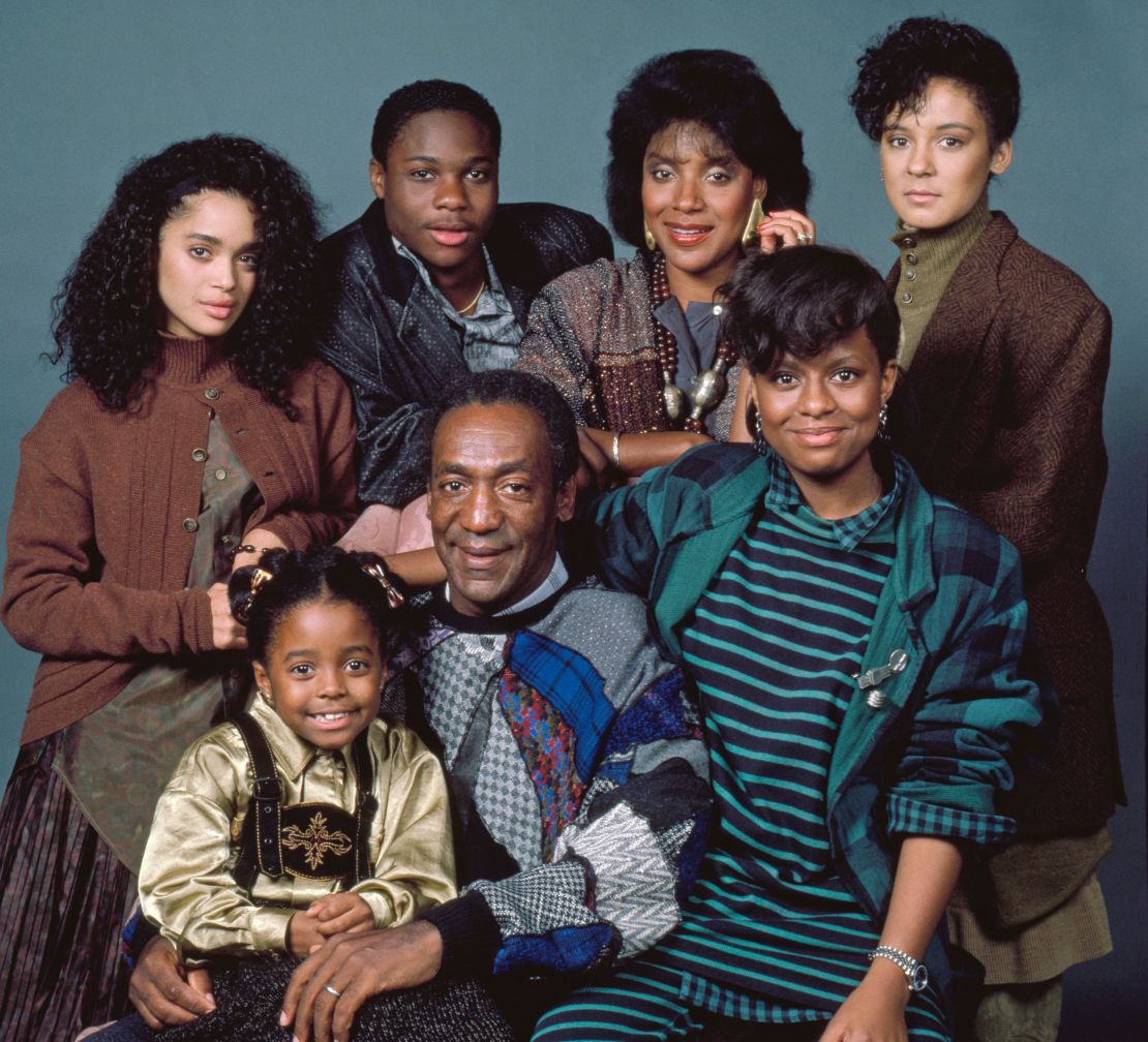 Warner poses with the cast of
