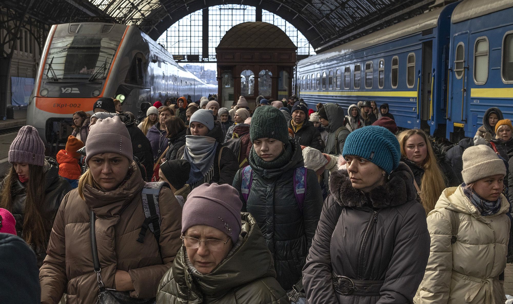 Passengers depart from the railway station in Lviv, Ukraine, after disembarking trains from the eastern part of the country on March 11, 2022.