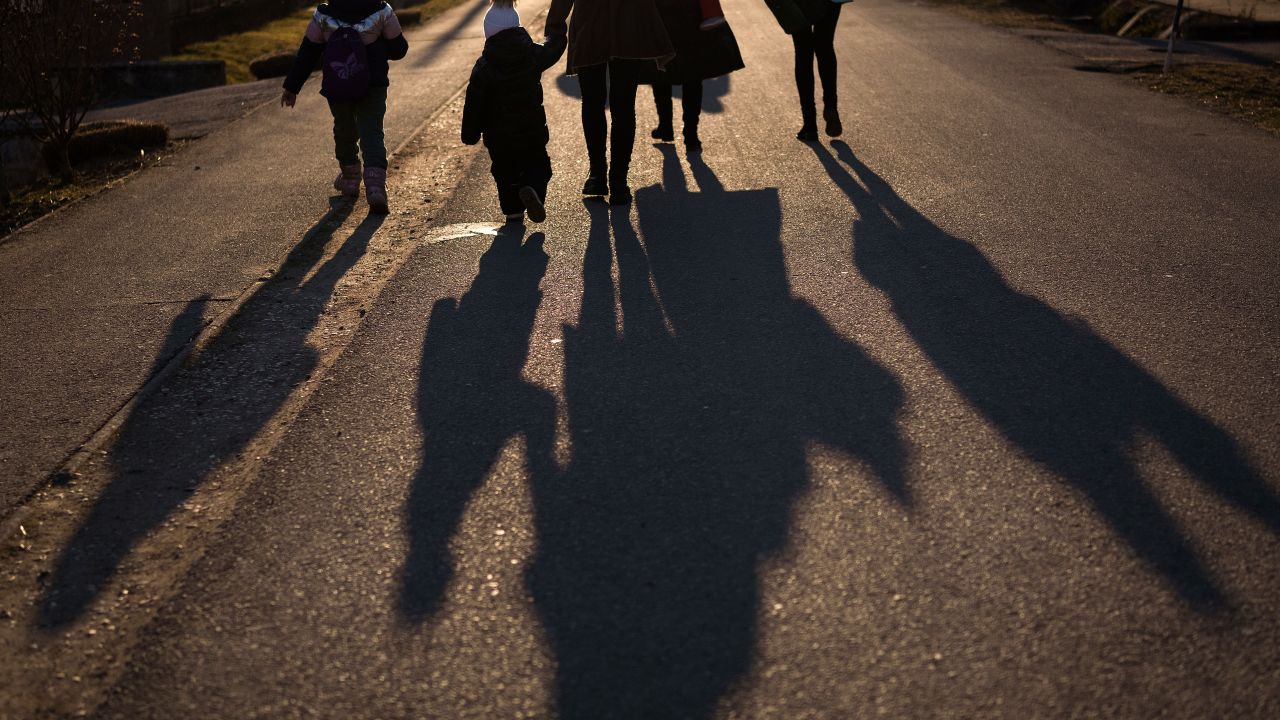 VELKE SLEMENCE, SLOVAKIA - MARCH 13: Refugees fleeing Ukraine walk to the reception centre at the Velke Slemence border crossing on March 13, 2022 in Velke Slemence, Slovakia. More than two million people have fled Ukraine into neighbouring countries since Russia launched a large-scale invasion of the country on February 24. (Photo by Christopher Furlong/Getty Images)