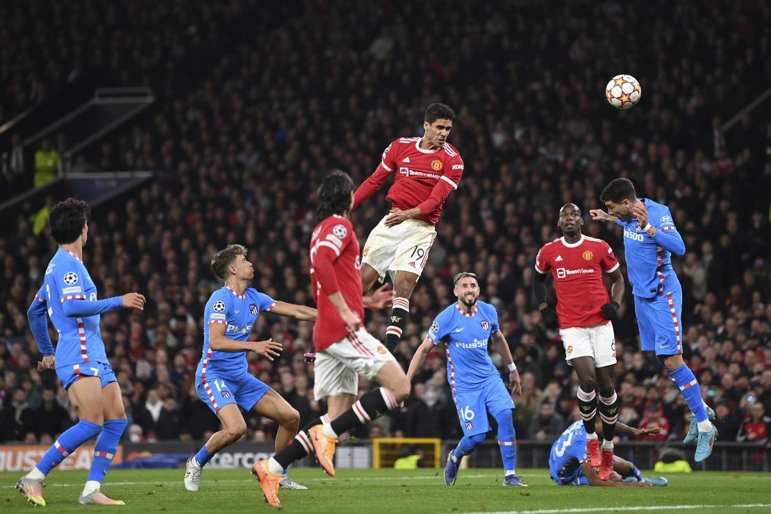 Raphael Varane of Manchester United heads the ball wide during the UEFA Champions League round Of 16 second-leg match between Manchester United and Atletico Madrid at Old Trafford on March 15, 2022 in Manchester, England.