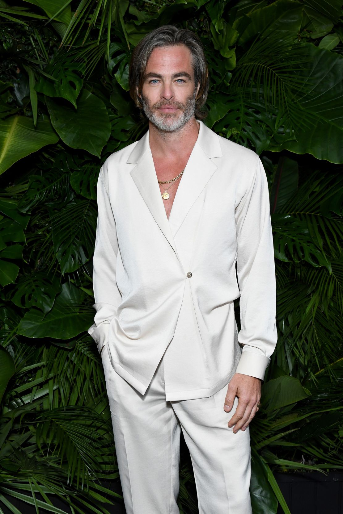 Pine in crisp cream pajama-style suiting at a Chanel event in Beverly Hills, California on March 26, 2022.
