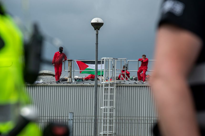 Police arrive as Palestine Action activists occupy the roof of the Thales UK arms factory in June 2022.