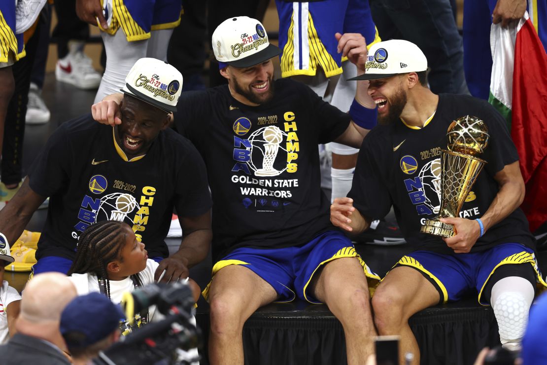 Green, Thompson and Curry celebrates the Warriors' 2022 championship victory.