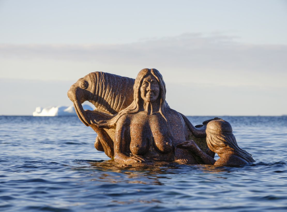 The "Mother of the Sea" sculpture by Christian Rosing sits in Nuuk's harbor.