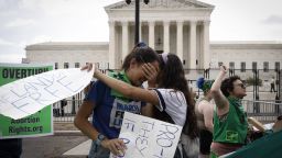 WASHINGTON, DC - JUNE 24:    Abortion rights activists Carrie McDonald  (L) and Soraya Bata react to the Dobbs v Jackson Women’s Health Organization ruling which overturns the landmark abortion Roe v. Wade case in front of the U.S. Supreme Court on June 24, 2022 in Washington, DC.   (Photo by Anna Moneymaker/Getty Images)
