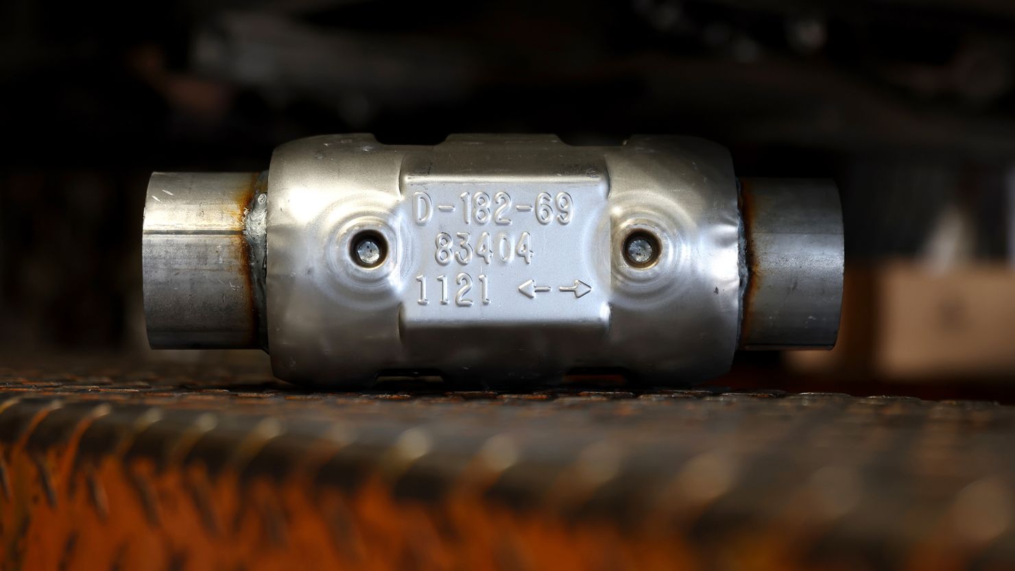 A brand new catalytic converter sits on a car lift at Johnny Franklin's Muffler on July 11, 2022 in San Rafael, California.