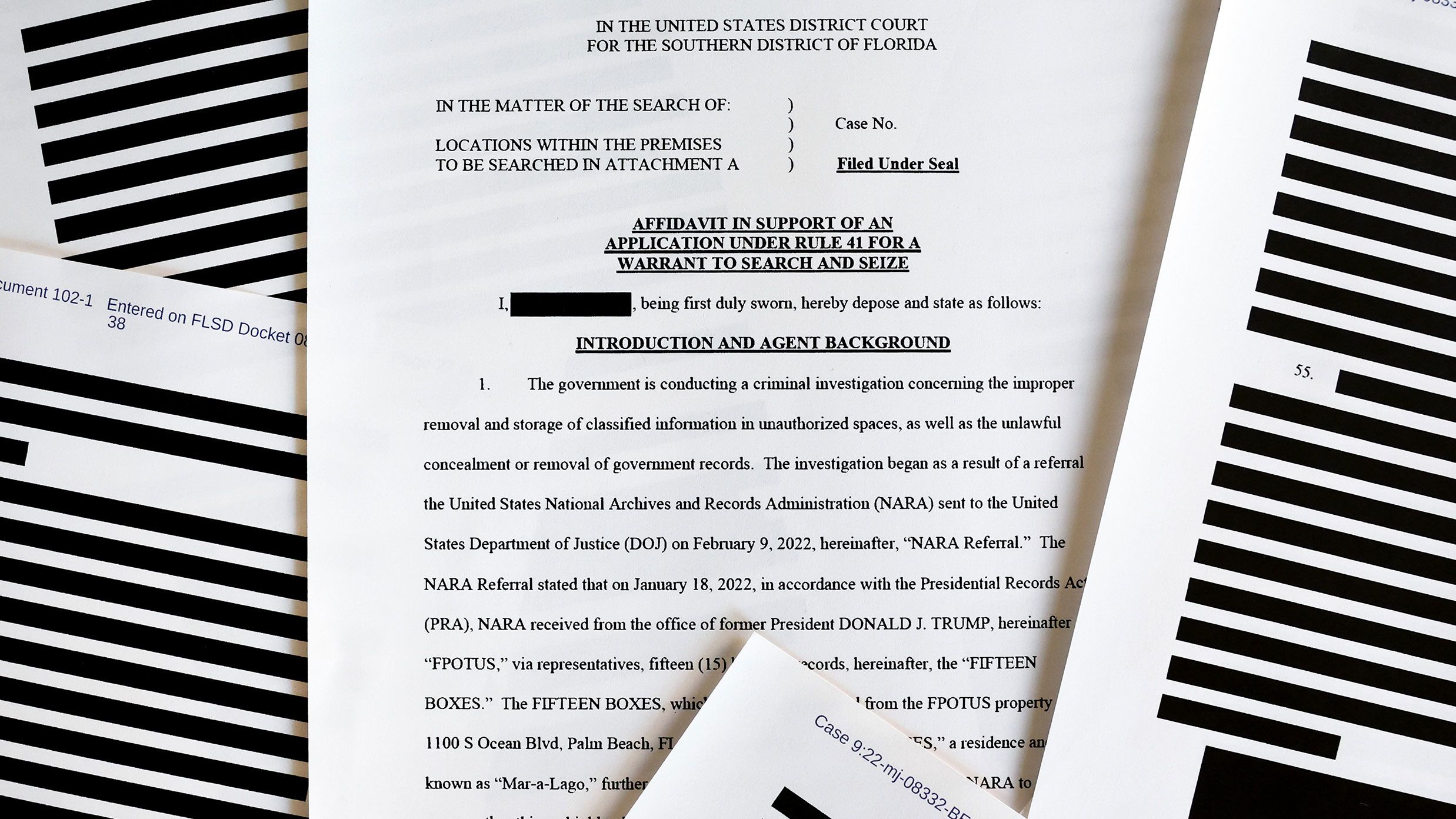 In this photo illustration, pages are viewed from the government's released version of the TBI search warrant affidavit for former President Donald Trump's Mar-a-Lago estate on August 27, 2022, in California.