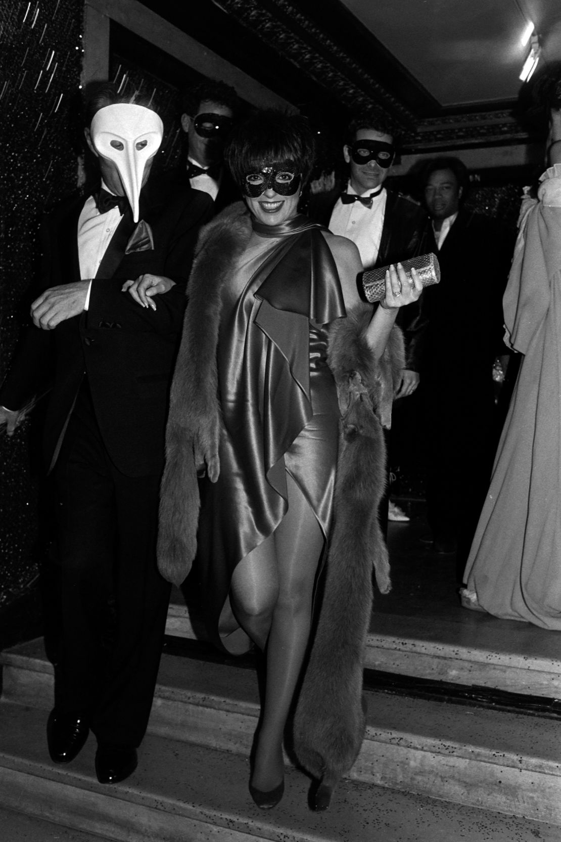 Halston and Liza Minnelli arrive at the Diamond Horseshoe club for a Halloween party in 1988.