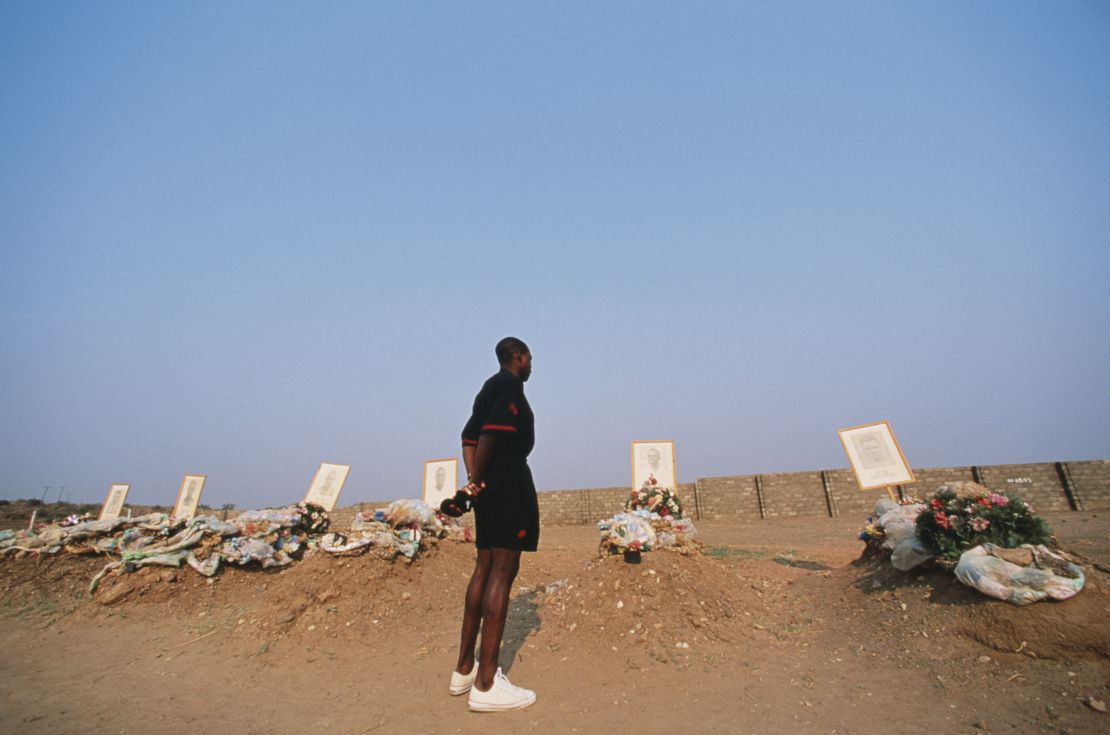 Zambia team captain Kalusha Bwalya pays his respects to the graves of the Zambian national team.